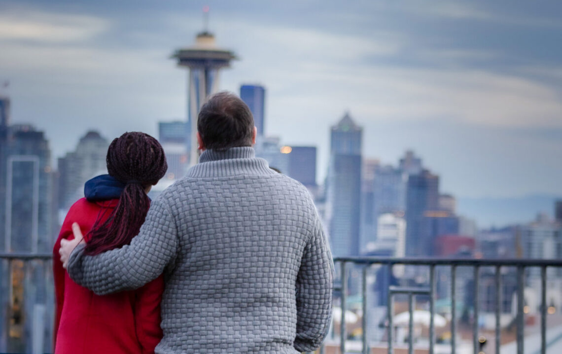 My fiance and I looking away from the camera, at the Space Needle